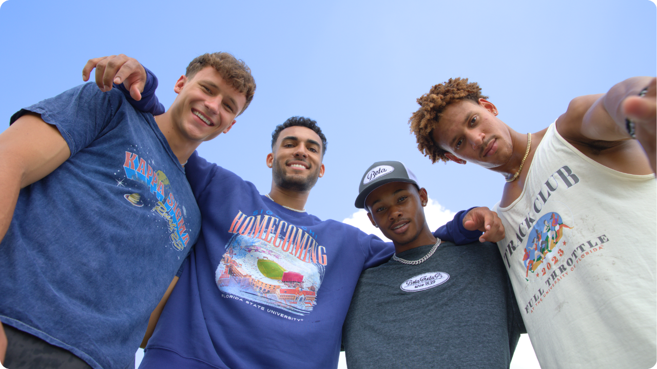 Four frat guys wearing custom merch