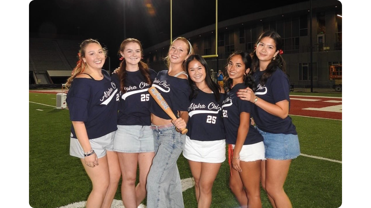 Alpha Chi Omega sorority girls in matching varsity themed shirts from Fresh Prints