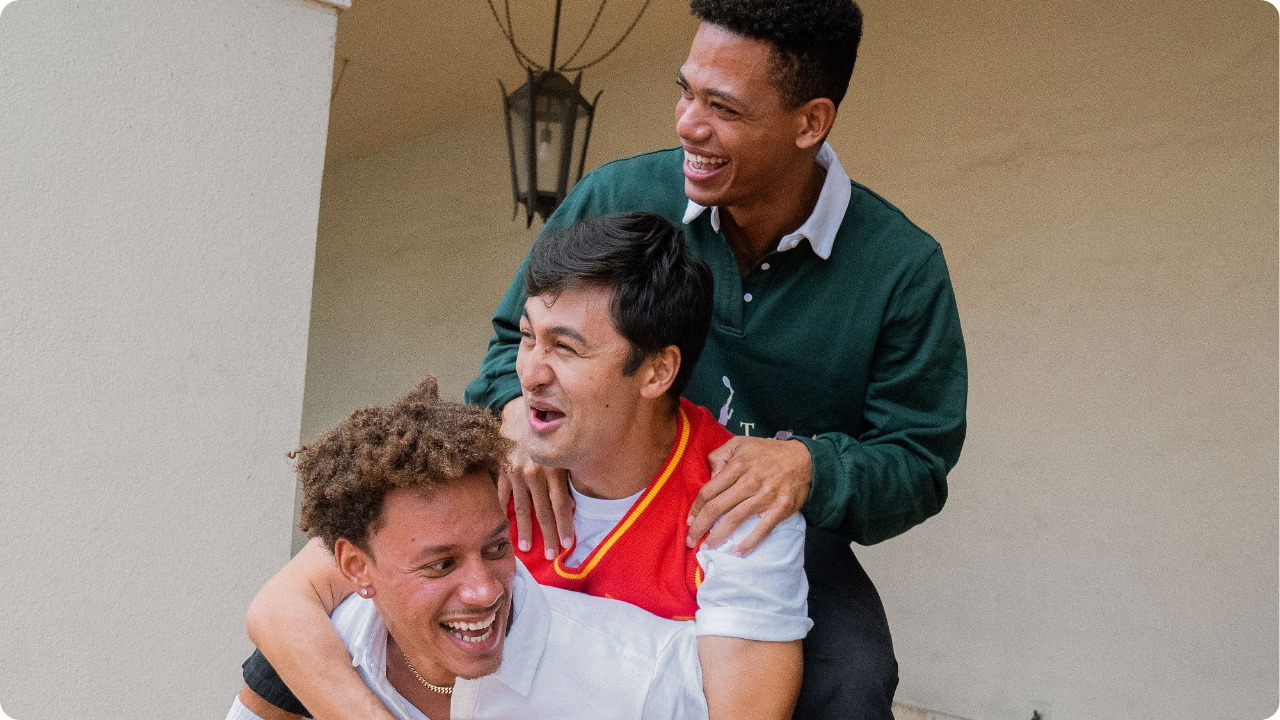 Three frat guys wearing merch