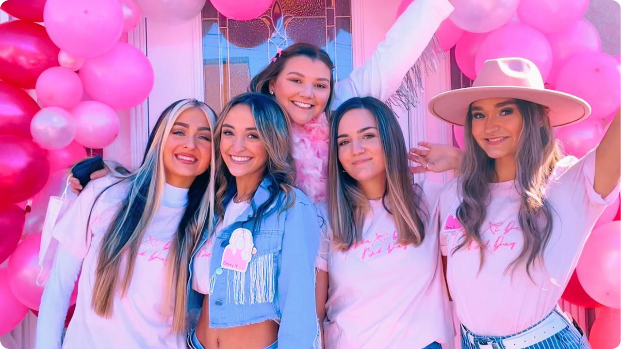 Sorority girls wearing custom pink-themed Bid Day merch