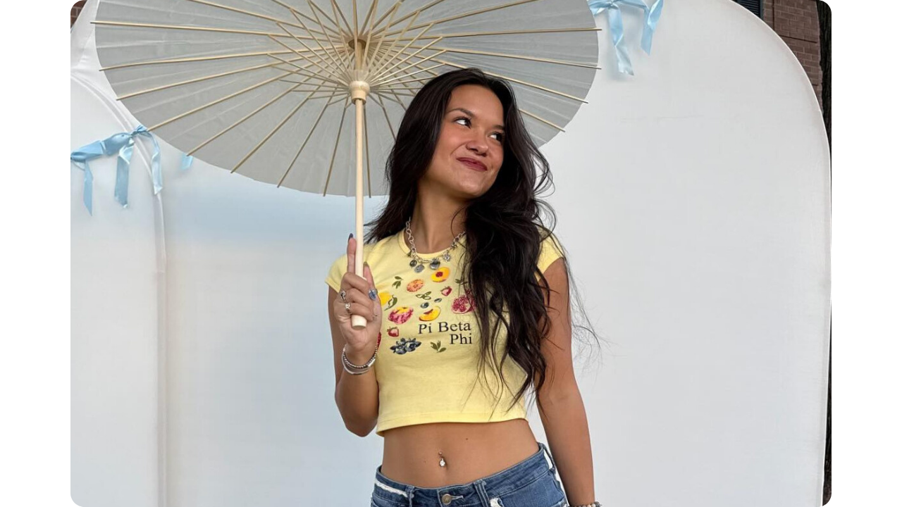 Girl wearing Pi Beta Phi merch, yellow mini tee created by Fresh Prints