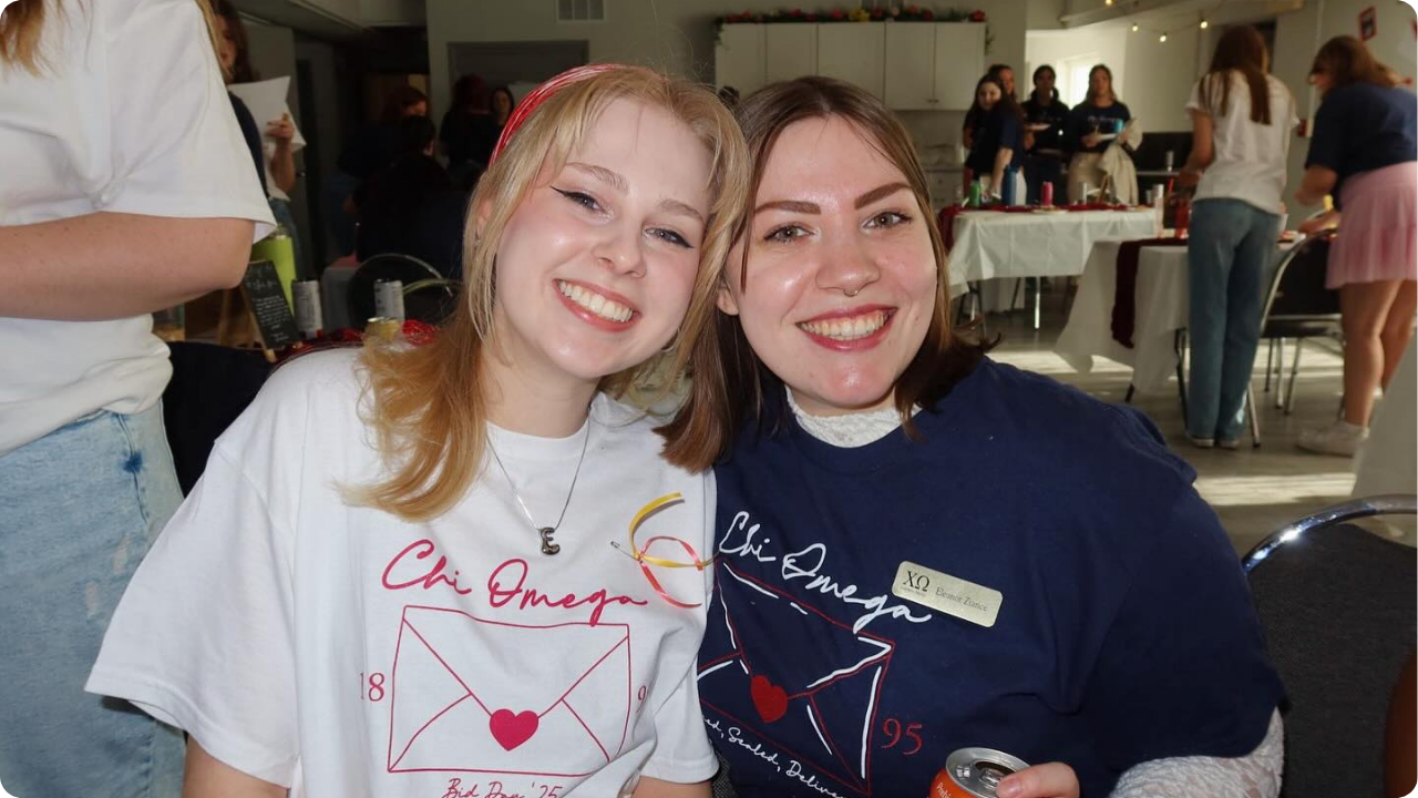 Two college girls wearing custom shirts