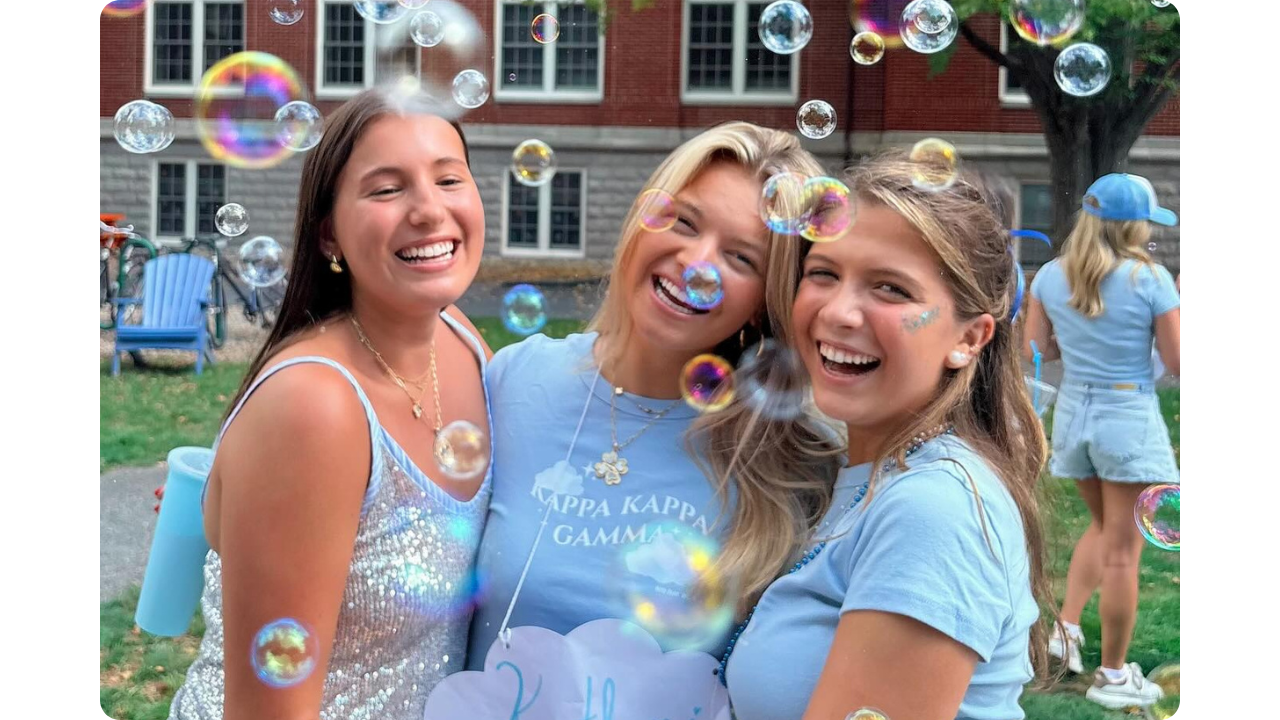 Three sorority girls from Kappa Kappa Gamma wearing light blue custom shirts from Fresh Prints