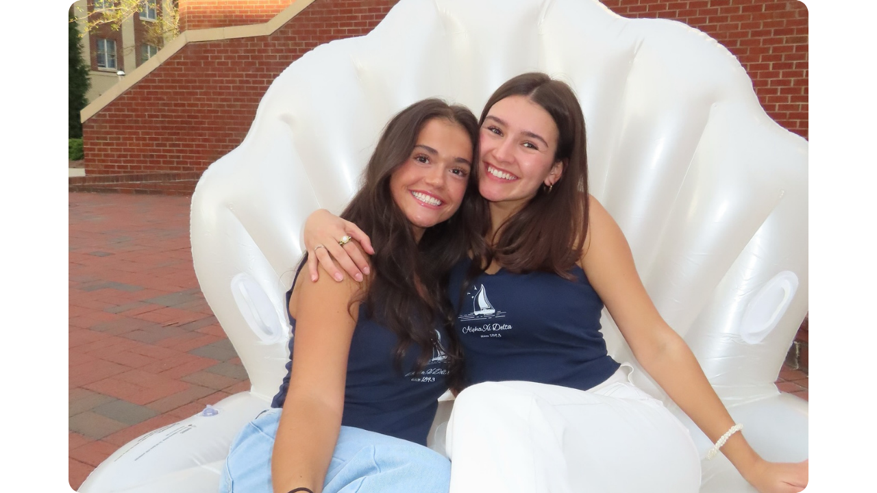 Alpha Xi Delta girls wearing matching custom tank tops by Fresh Prints